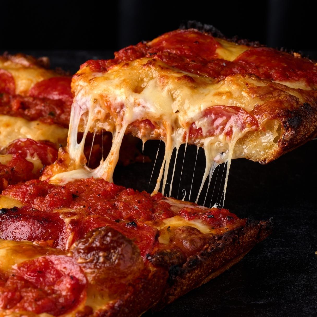 Detroit-style pepperoni pizza with a cheese pull at McFiler's